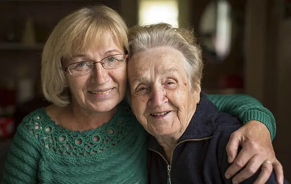 Portrait of an adult woman with his elderly mother.